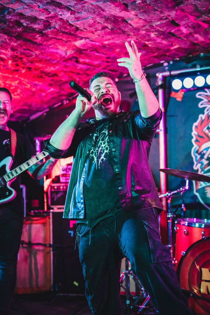 Time Stands Still Band - live shot of singer Liam Hesslewood playing live at Bannermans in Edinburgh